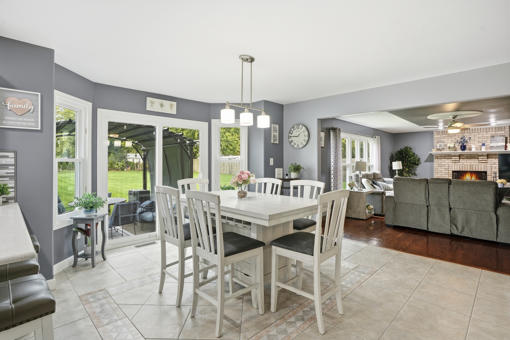 11254 192nd Street Mokena, IL 60448 - Photo 17 of 48 a dining room with furniture large windows and a chandelier