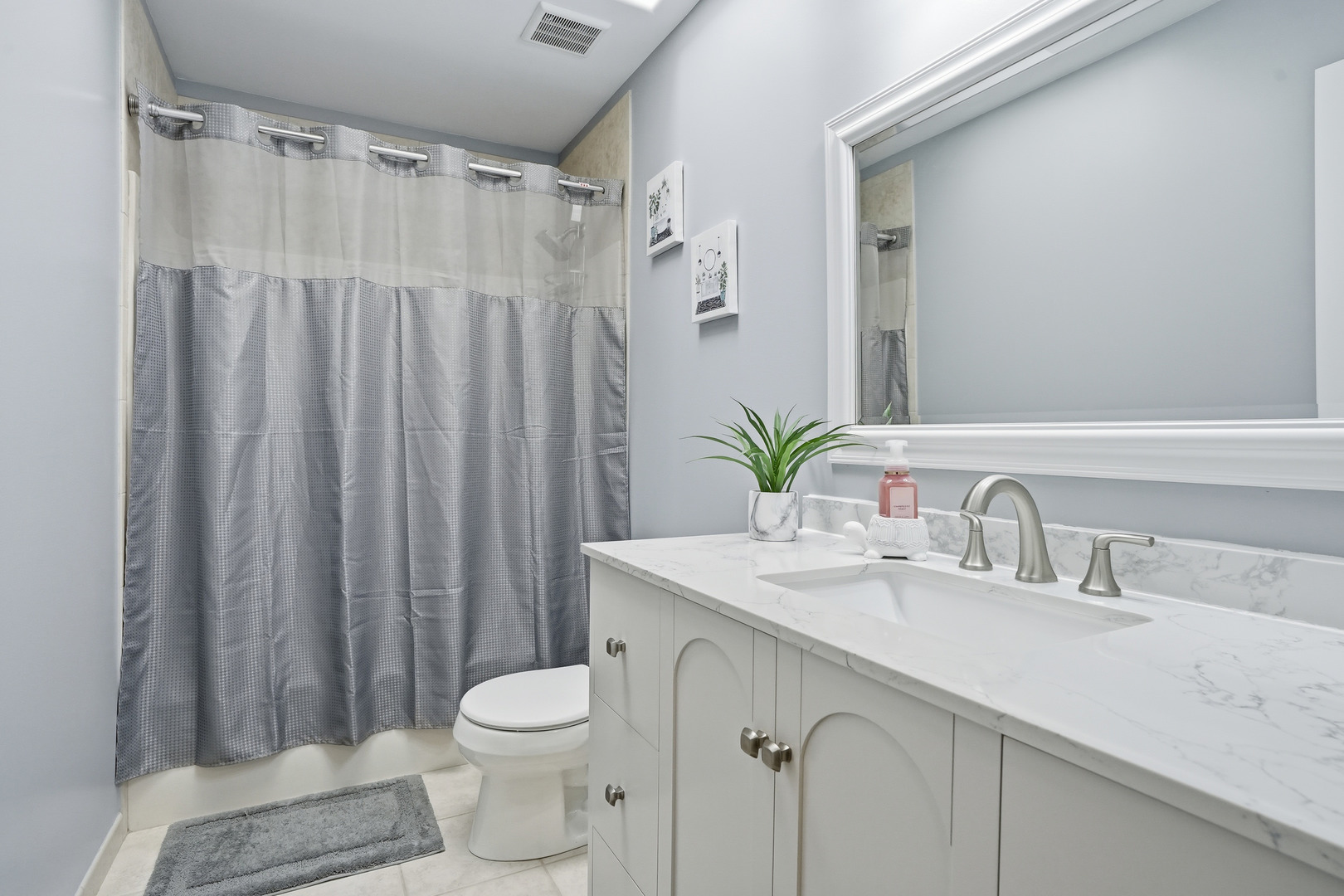 11254 192nd Street Mokena, IL 60448 - Photo 29 of 48 a bathroom with a sink a toilet and shower
