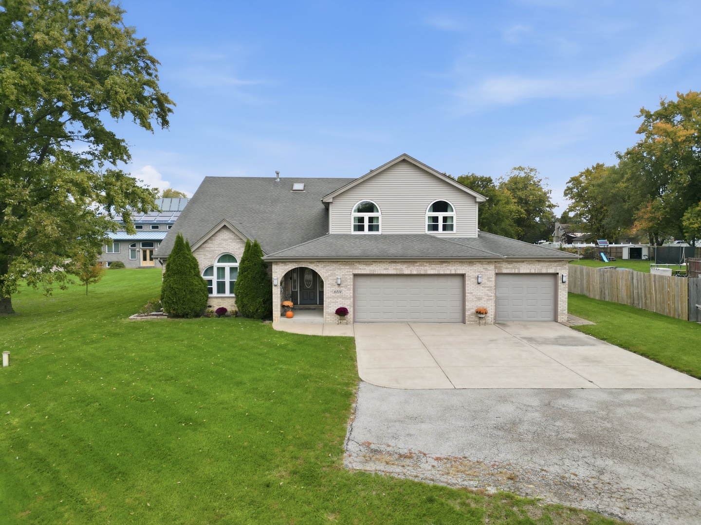 11254 192nd Street Mokena, IL 60448 - Photo 3 of 48 a front view of a house with a yard and garage