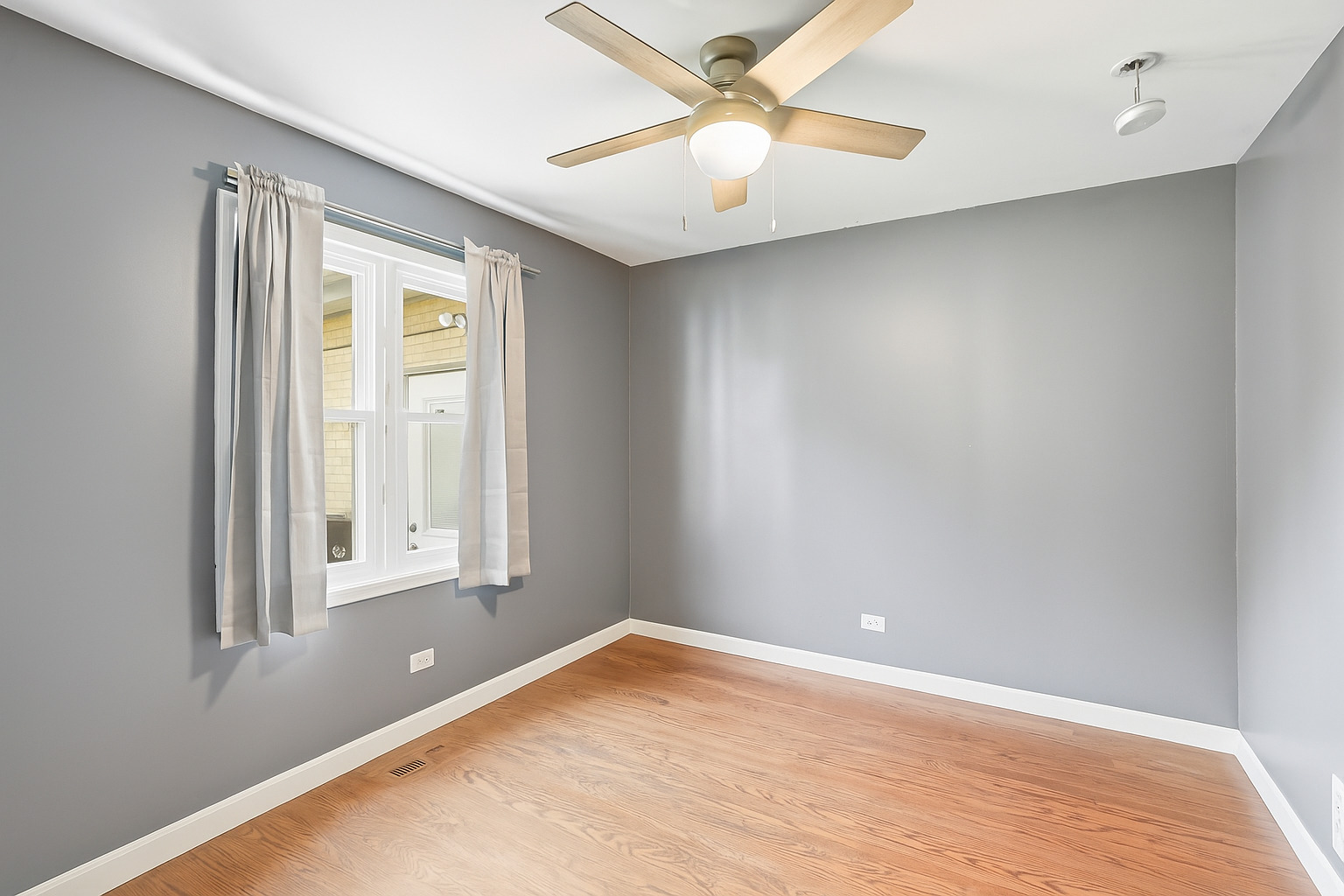 11254 192nd Street Mokena, IL 60448 - Photo 34 of 48 an empty room with a window and a fan