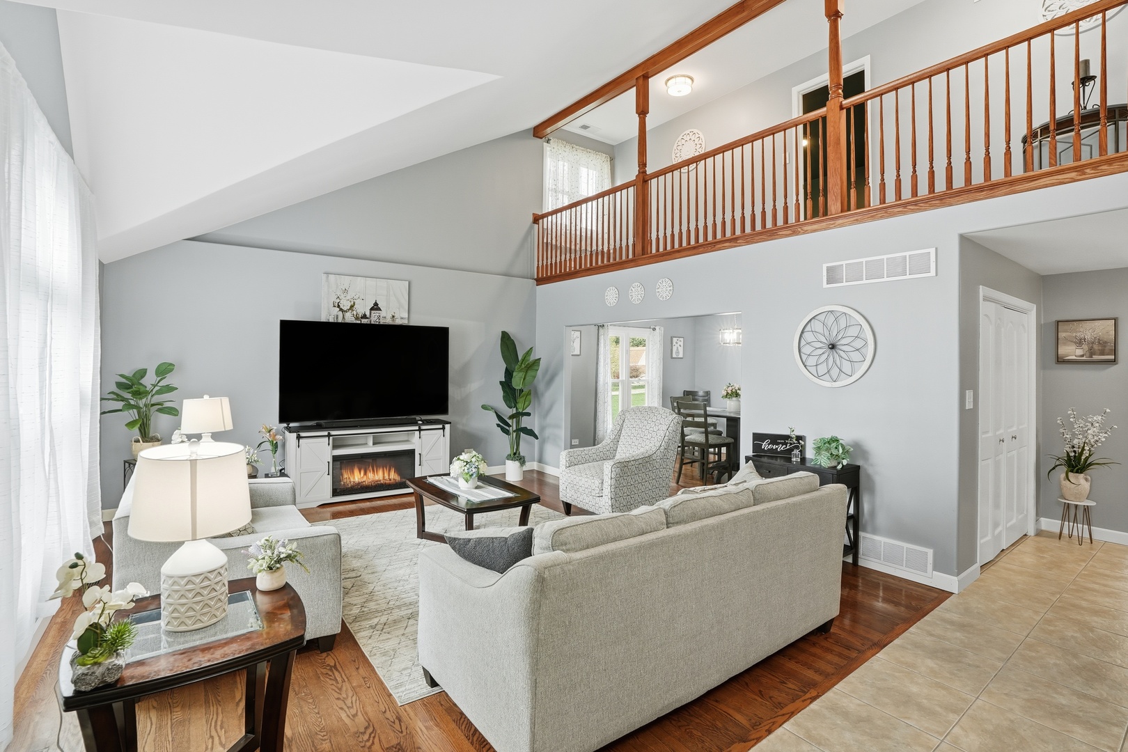 11254 192nd Street Mokena, IL 60448 - Photo 9 of 48 a living room with furniture a flat screen tv and a window