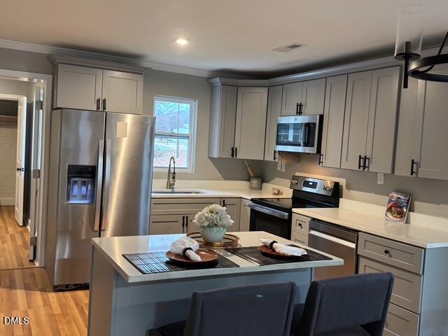 1005 East Hanover Road Graham, NC 27253 - Photo 4 of 8 a kitchen with stainless steel appliances granite countertop a refrigerator stove and sink