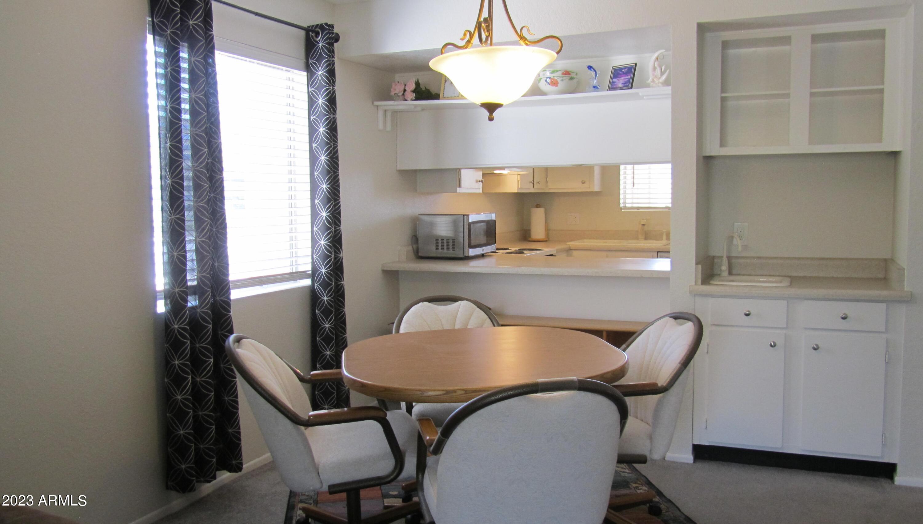 4150 East Cactus Road, Unit 101 Phoenix, AZ 85032 - Photo 8 of 27 DINING AREA