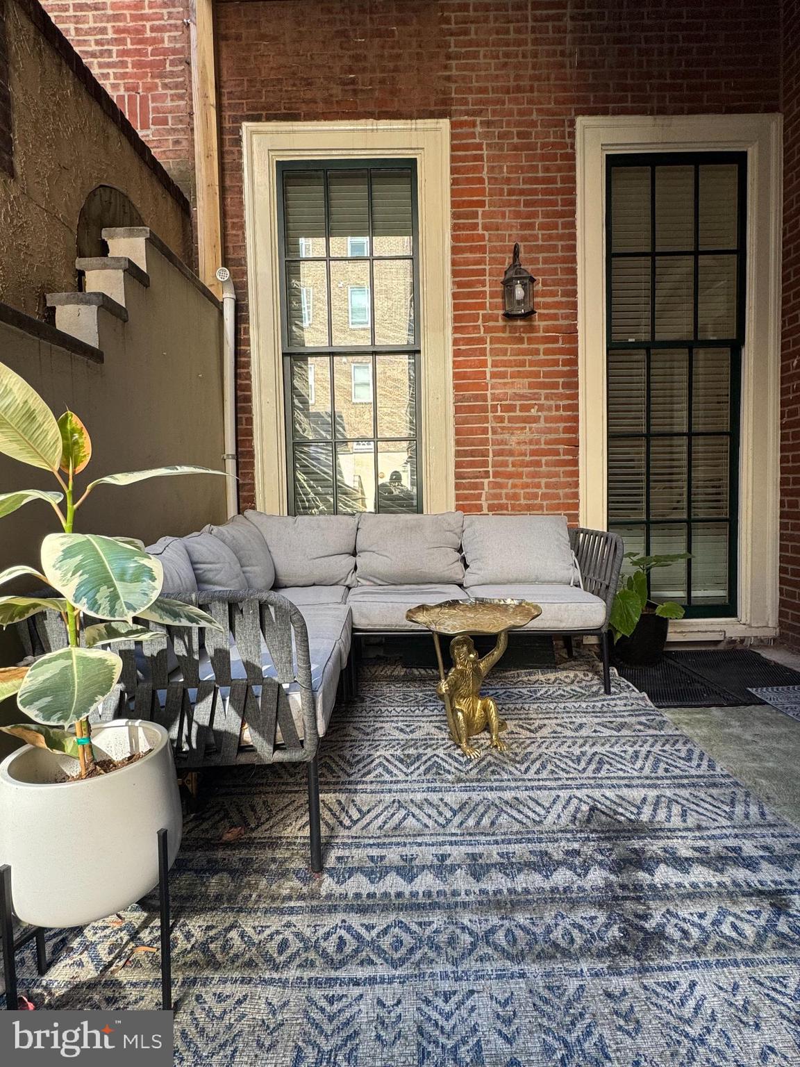 1015 Clinton Street, Unit 1F Philadelphia, PA 19107 - Photo 17 of 17 a living room with furniture and a window