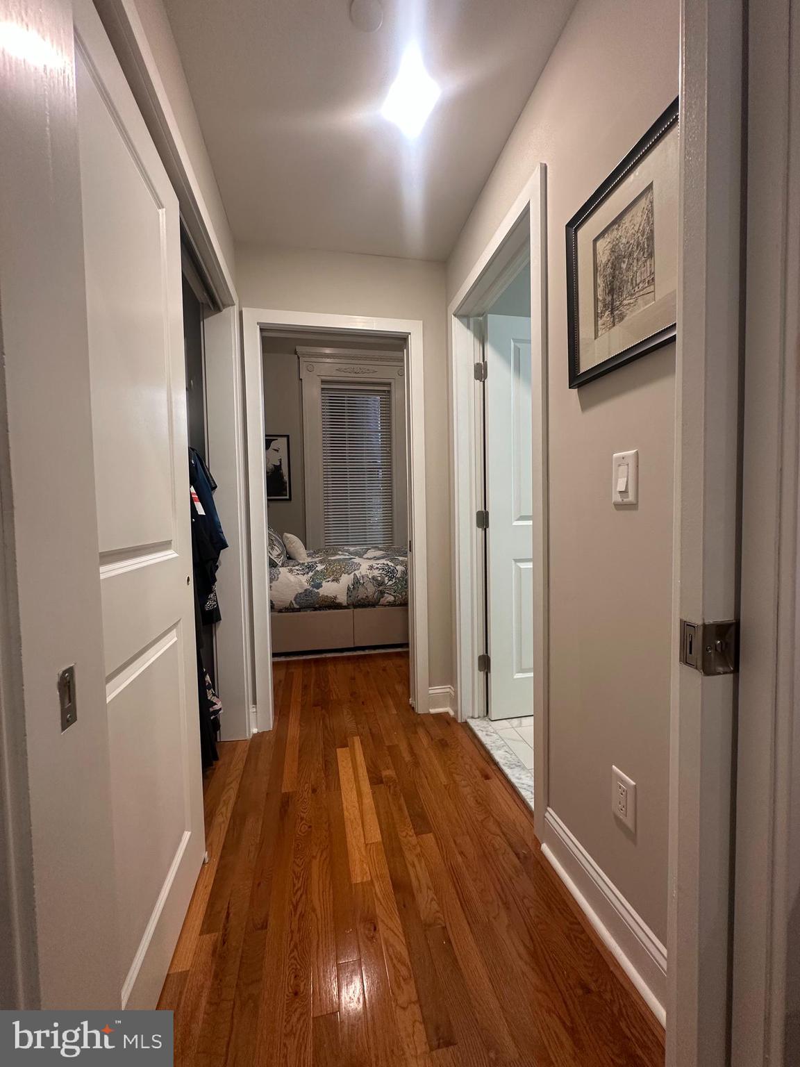 1015 Clinton Street, Unit 1F Philadelphia, PA 19107 - Photo 10 of 17 a view of a hallway view with wooden floor and staircase
