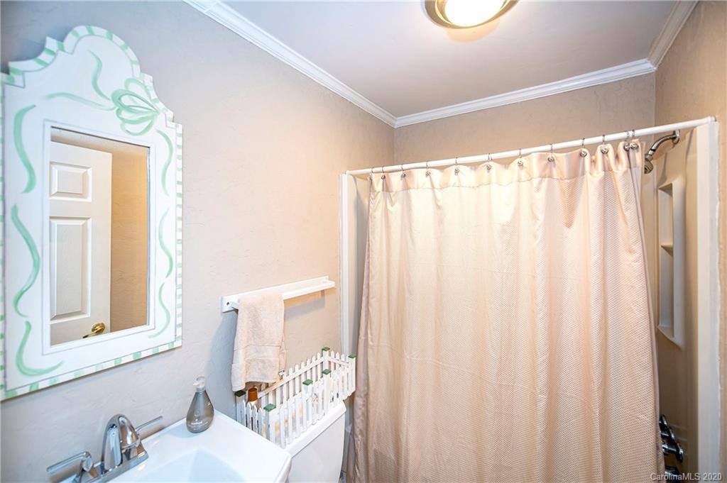 817 Bonum Road Lake Wylie, SC 29710 - Photo 24 of 41 a bathroom with a sink a mirror and a shower curtain
