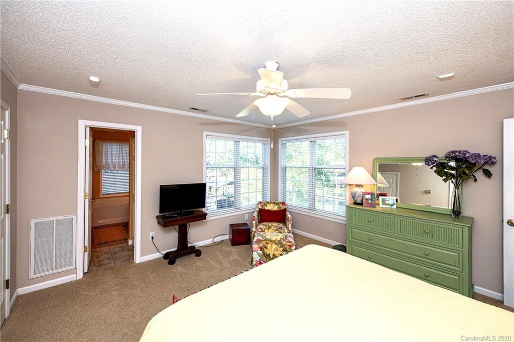 817 Bonum Road Lake Wylie, SC 29710 - Photo 26 of 41 a bedroom with a bed and a flat screen tv