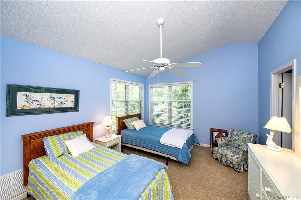 817 Bonum Road Lake Wylie, SC 29710 - Photo 30 of 41 a bedroom with furniture and a chandelier