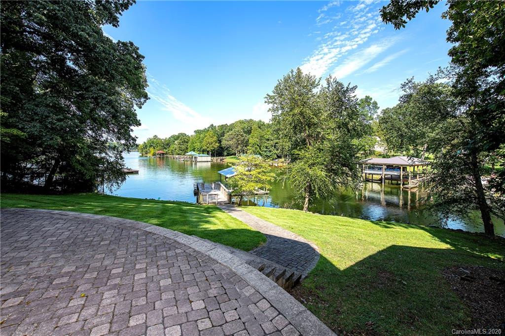 817 Bonum Road Lake Wylie, SC 29710 - Photo 35 of 41 a view of a lake with a big yard and large trees