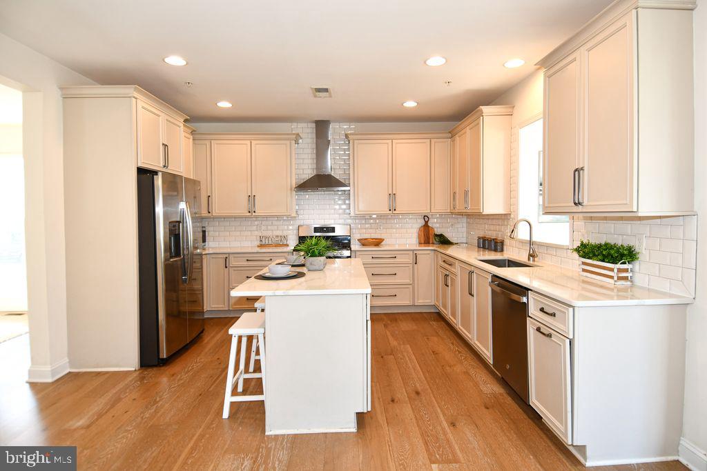 2013 Conley Court Silver Spring, MD 20904 - Photo 1 of 41 a kitchen with a sink a counter top space stainless steel appliances and cabinets