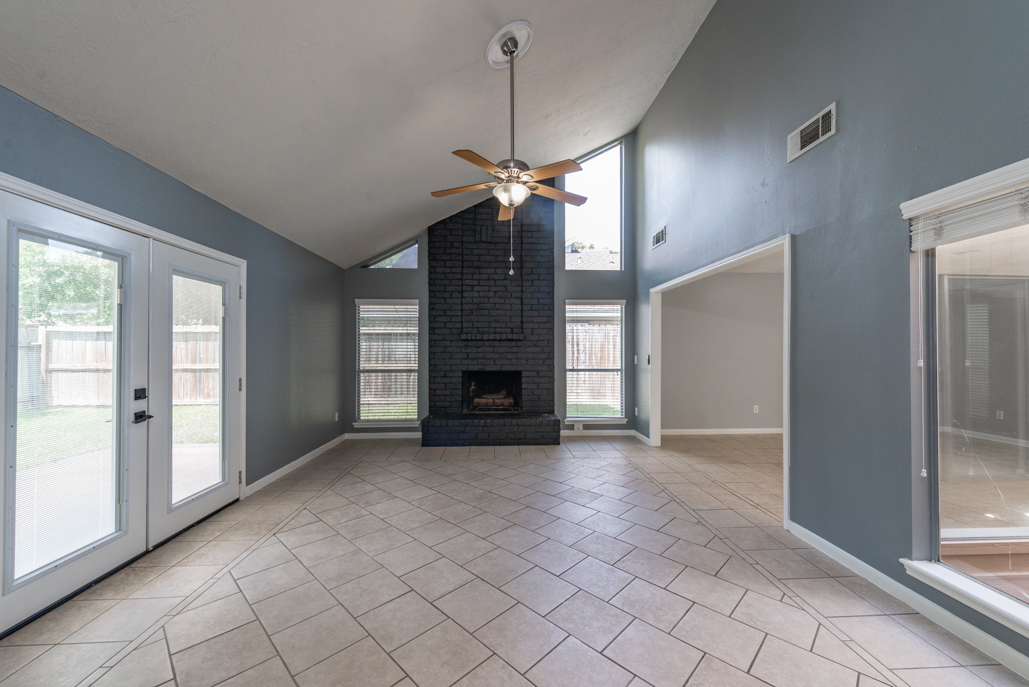 1022 White Sands Road Katy, TX 77450 - Photo 8 of 27 Family room showing upgraded French doors, fireplace and atrium view.