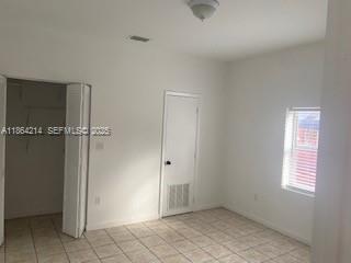 1537 Southwest 1st Street, Unit 2 Miami, FL 33135 - Photo 8 of 10 an empty room with windows