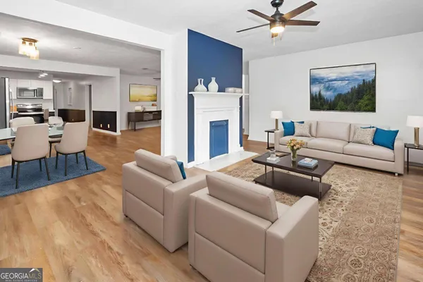 a living room with furniture and a fireplace