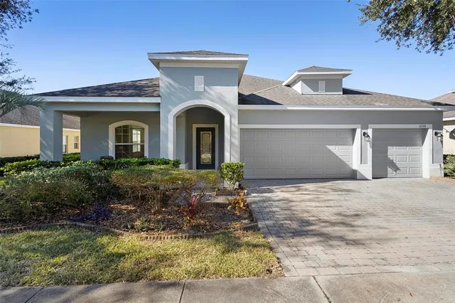 a front view of a house with yard