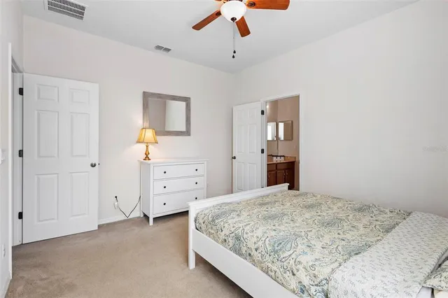 a bedroom with a bed and a table