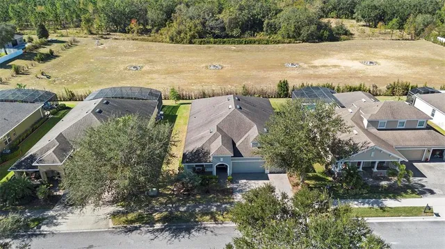 a aerial view of multiple houses with yard