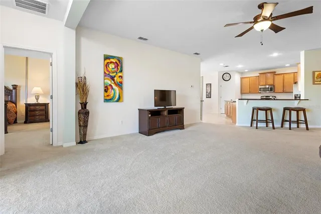 a view of a livingroom with furniture and flat screen tv