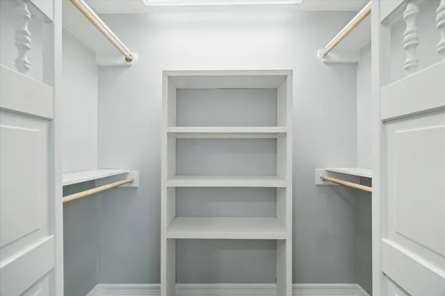 a view of an empty walk in closet