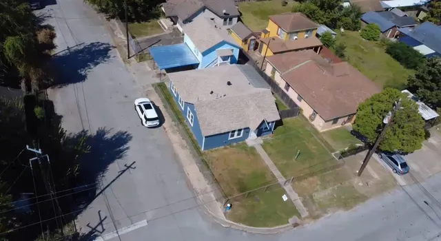 an aerial view of a house with outdoor space