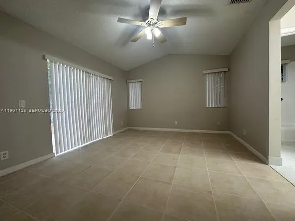 a view of an empty room with a window