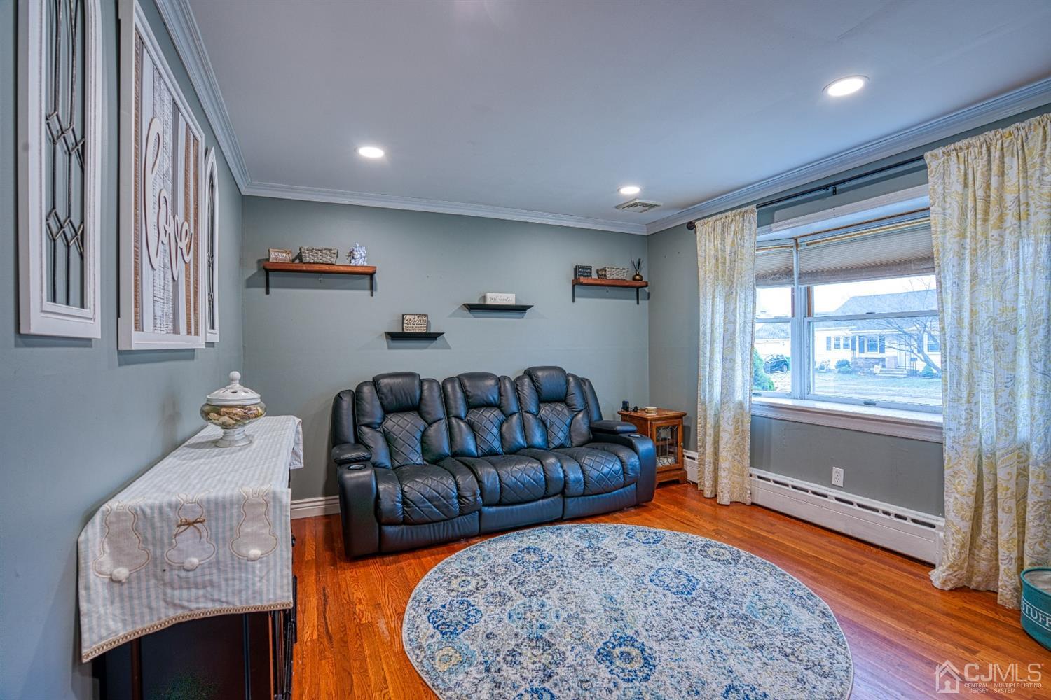 8 Clausen Road Edison, NJ 08817 - Photo 2 of 17 a living room with furniture and a rug