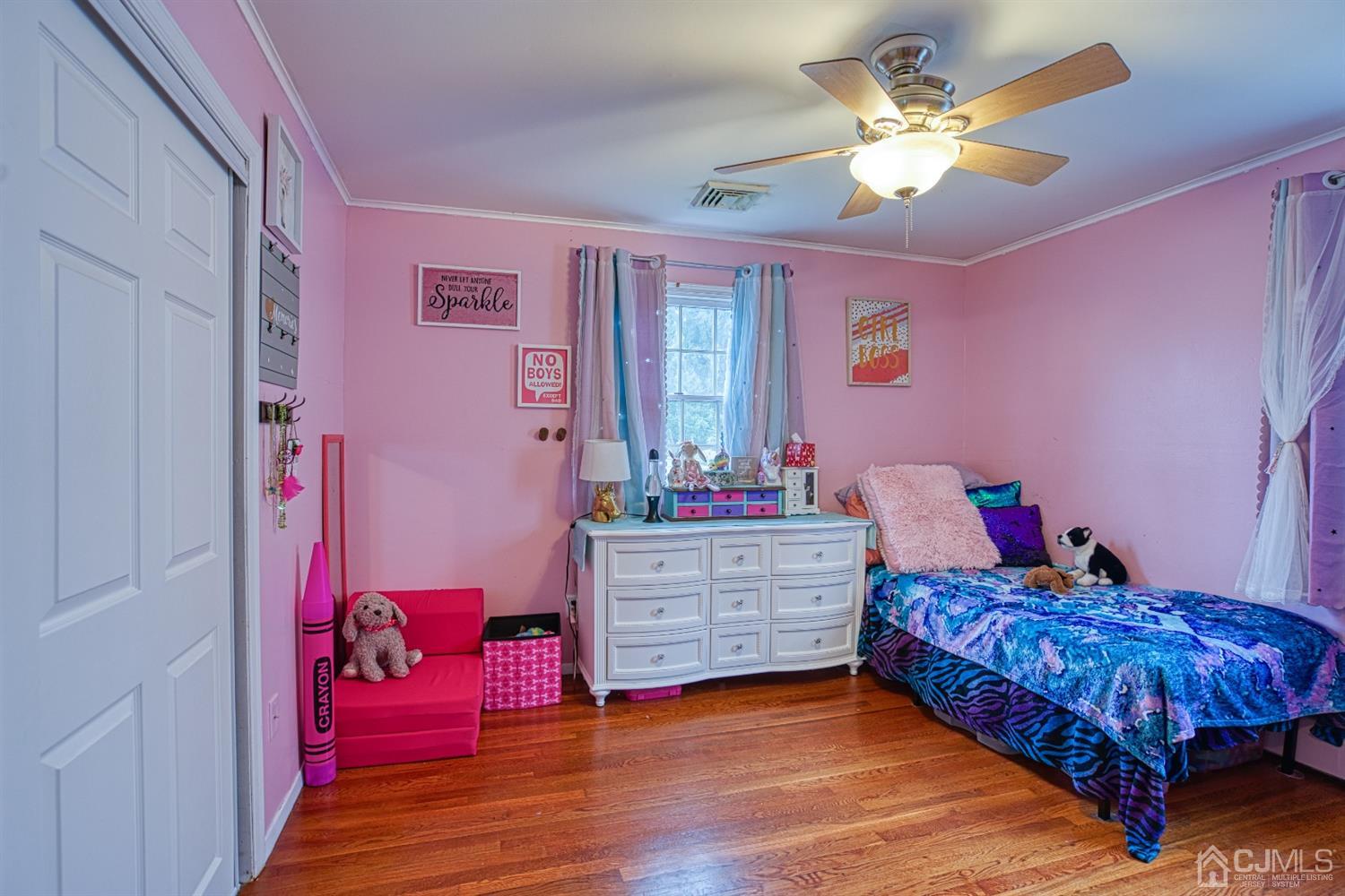 8 Clausen Road Edison, NJ 08817 - Photo 9 of 17 a bed room with a bed and a chandelier