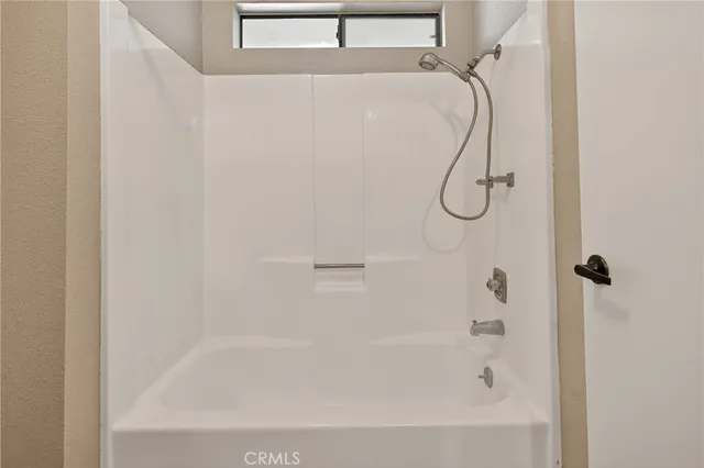 a close up of a bathtub curtain