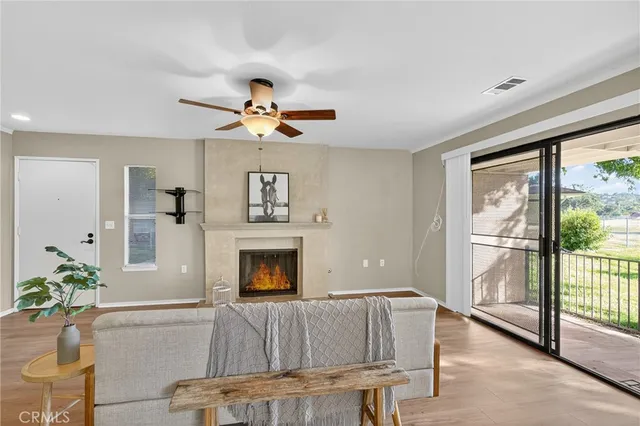 a living room with furniture fireplace and flat screen tv