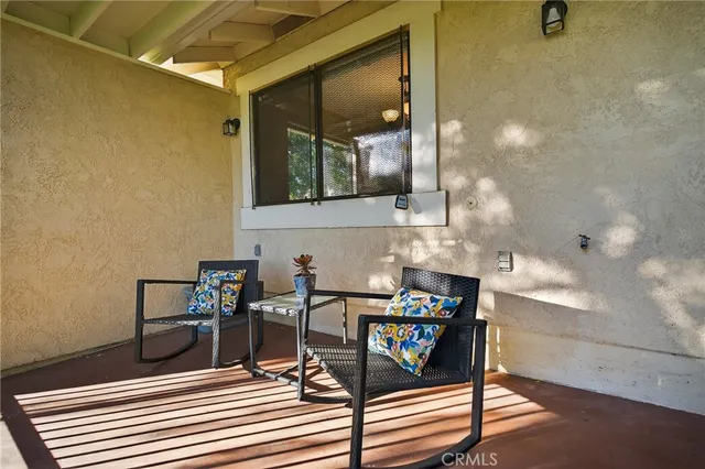 a view of a chairs and table in a room