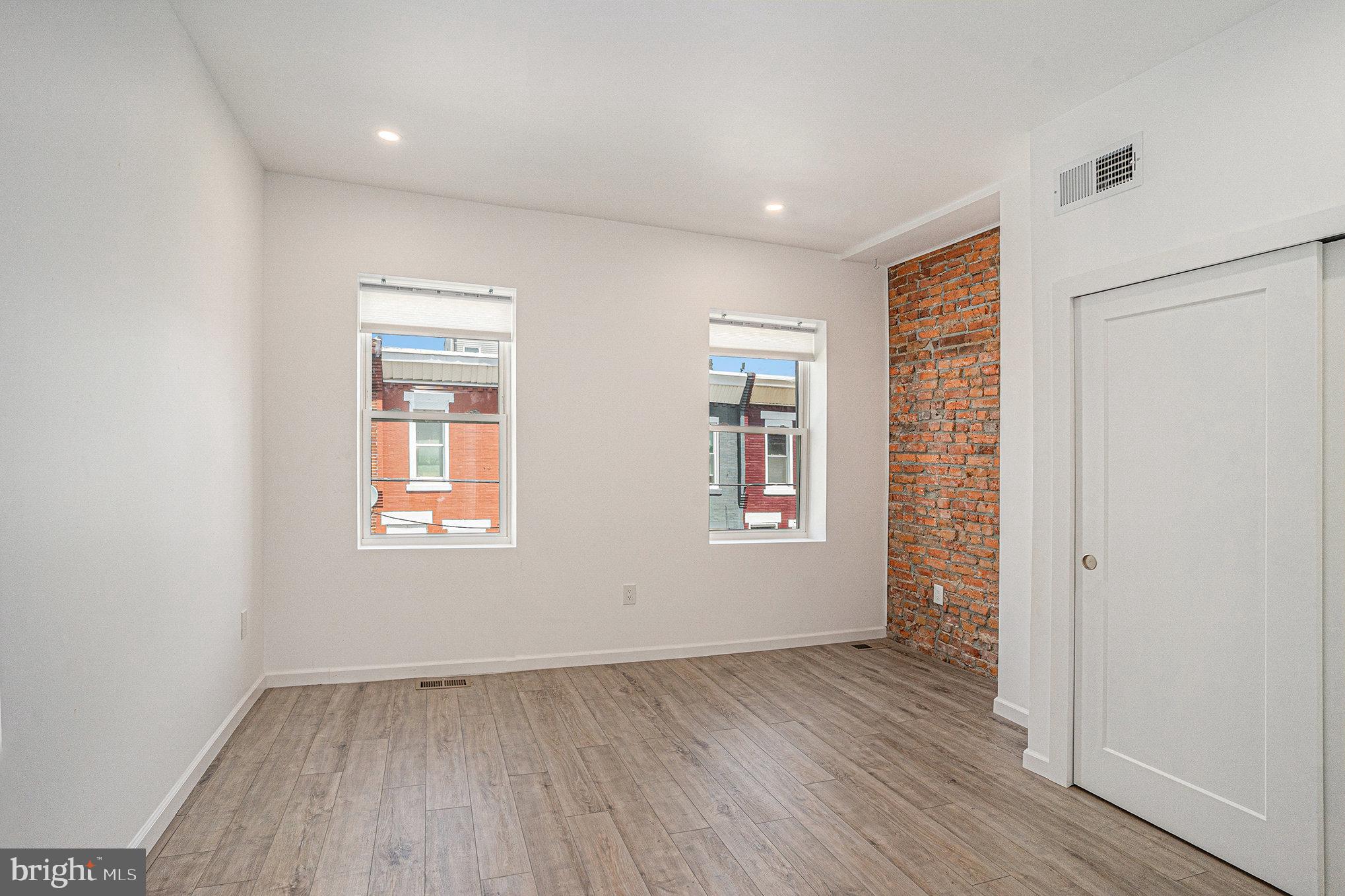 2128 Fernon Street Philadelphia, PA 19145 - Photo 15 of 30 an empty room with wooden floor and windows