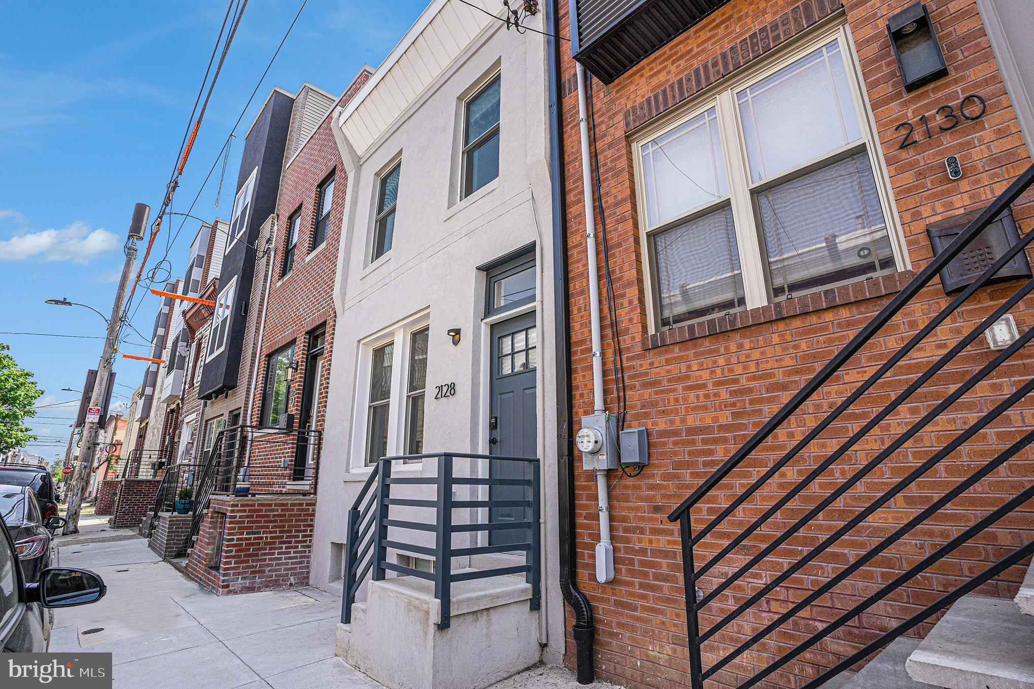 2128 Fernon Street Philadelphia, PA 19145 - Photo 2 of 30 a view of a brick building with many windows