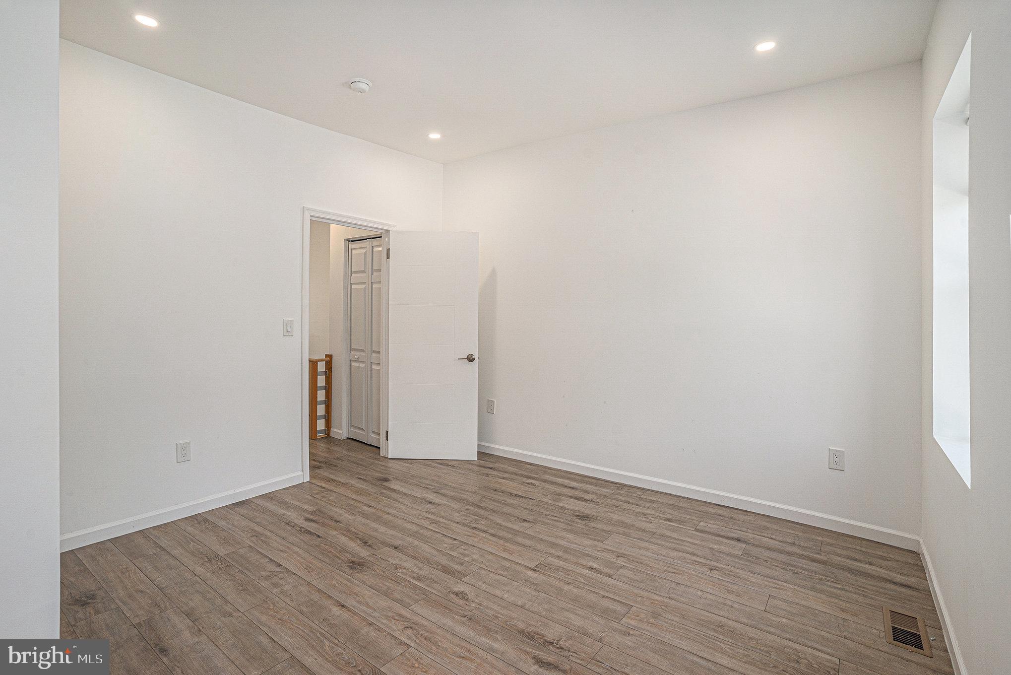 2128 Fernon Street Philadelphia, PA 19145 - Photo 21 of 30 a view of an empty room with wooden floor and closet
