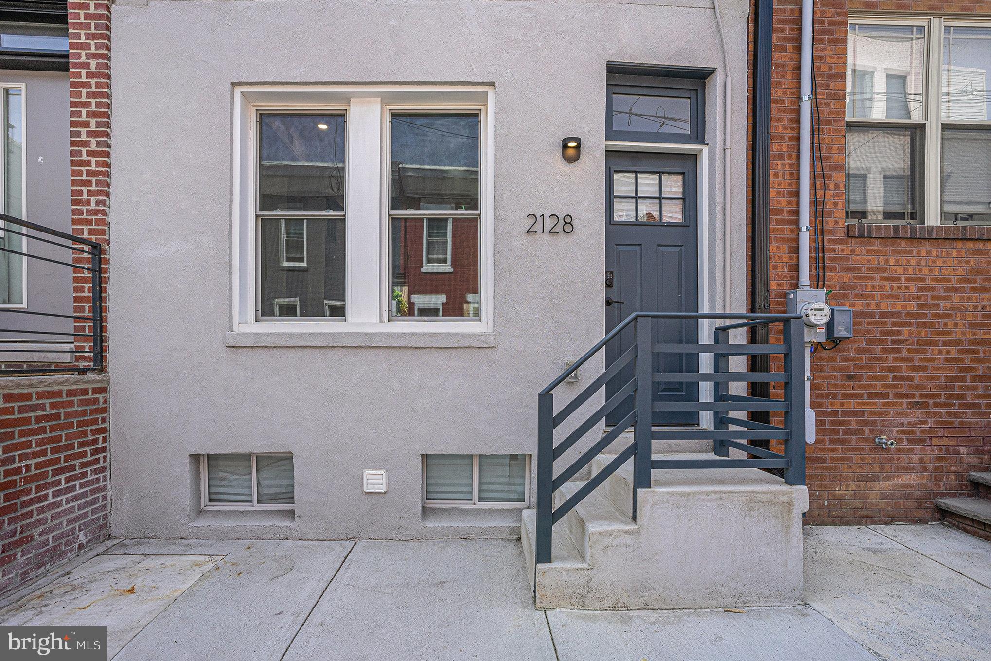 2128 Fernon Street Philadelphia, PA 19145 - Photo 3 of 30 a front view of a house with a yard