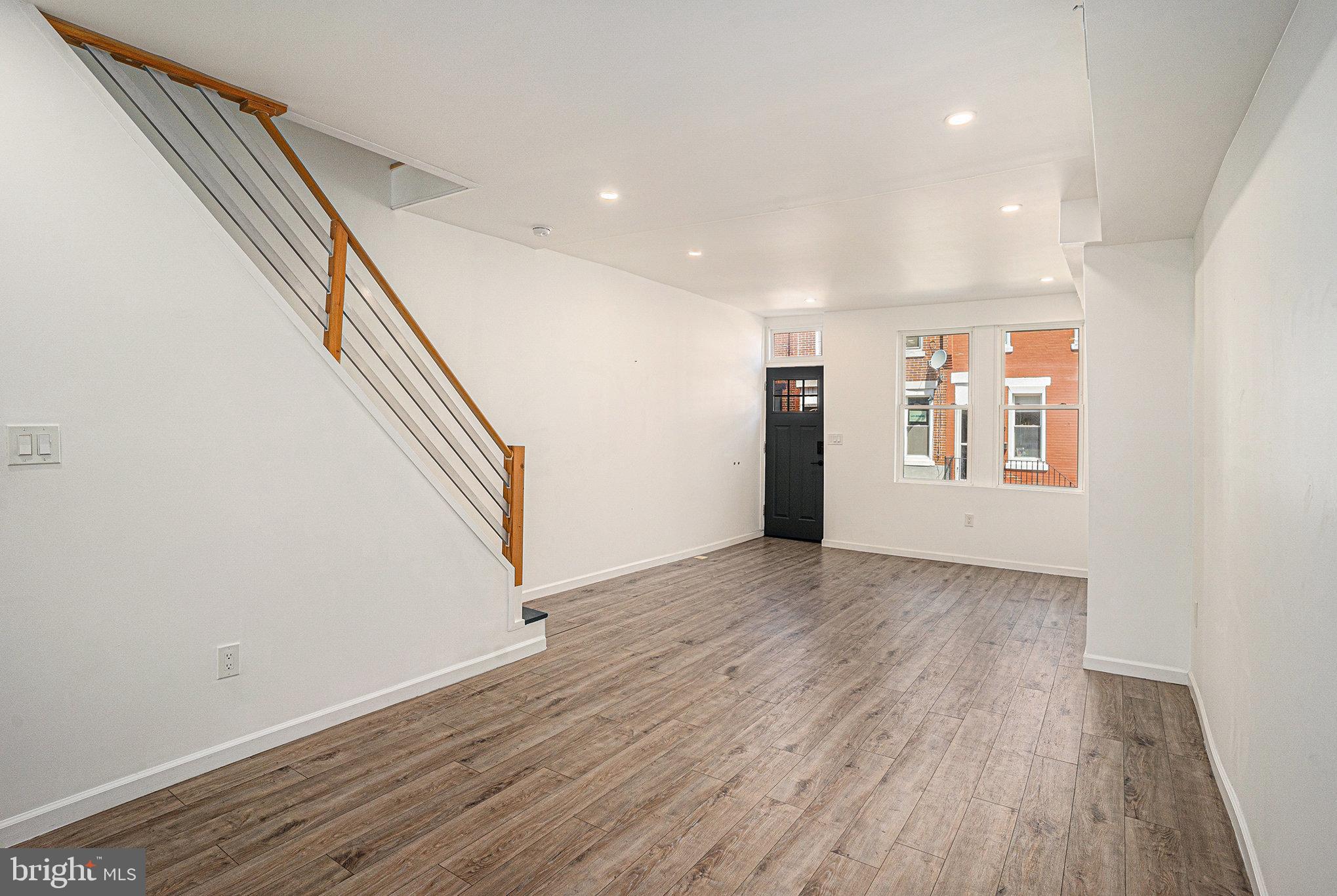 2128 Fernon Street Philadelphia, PA 19145 - Photo 5 of 30 wooden floor in an empty room with a window