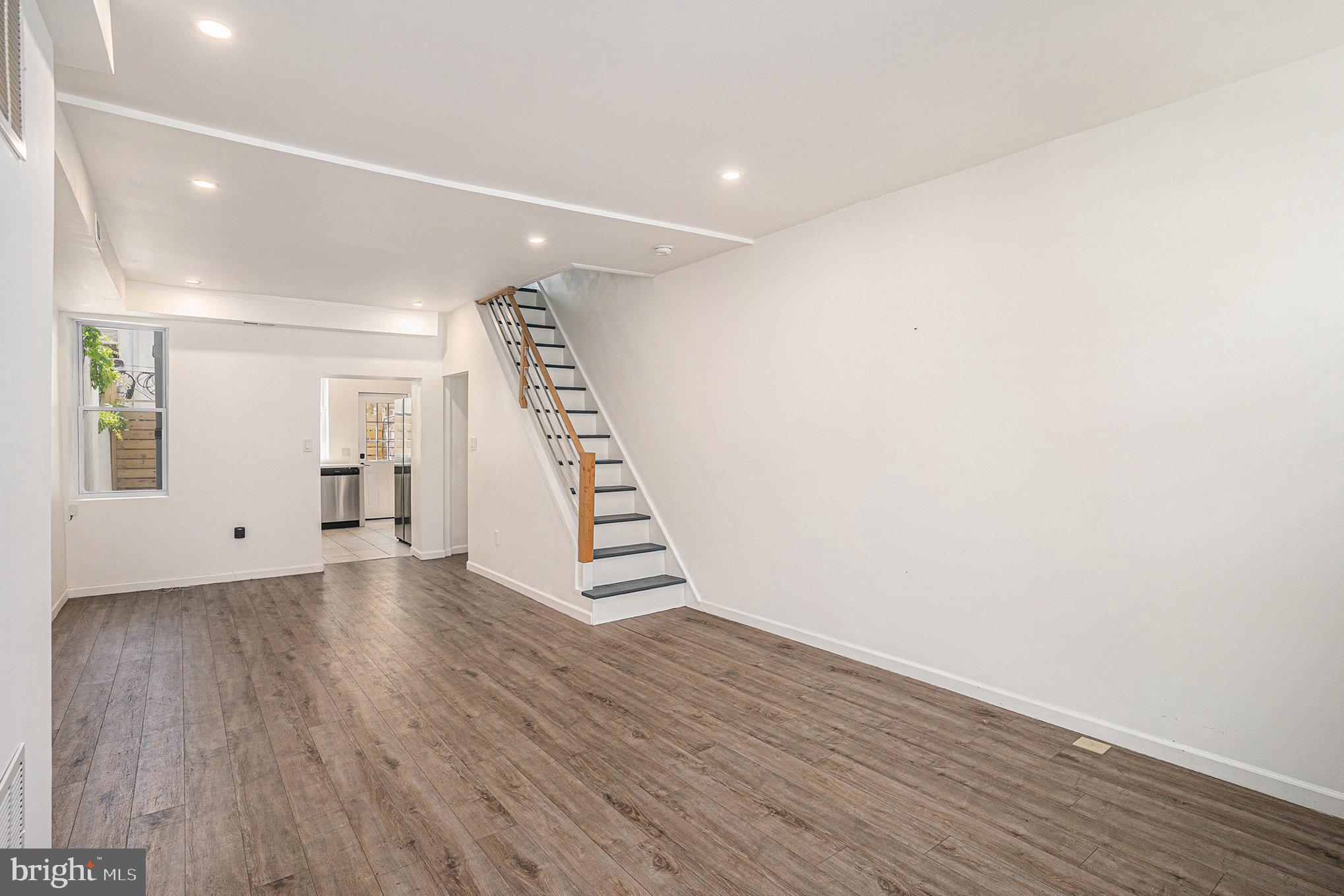 2128 Fernon Street Philadelphia, PA 19145 - Photo 6 of 30 a view of wooden floor and windows in a room