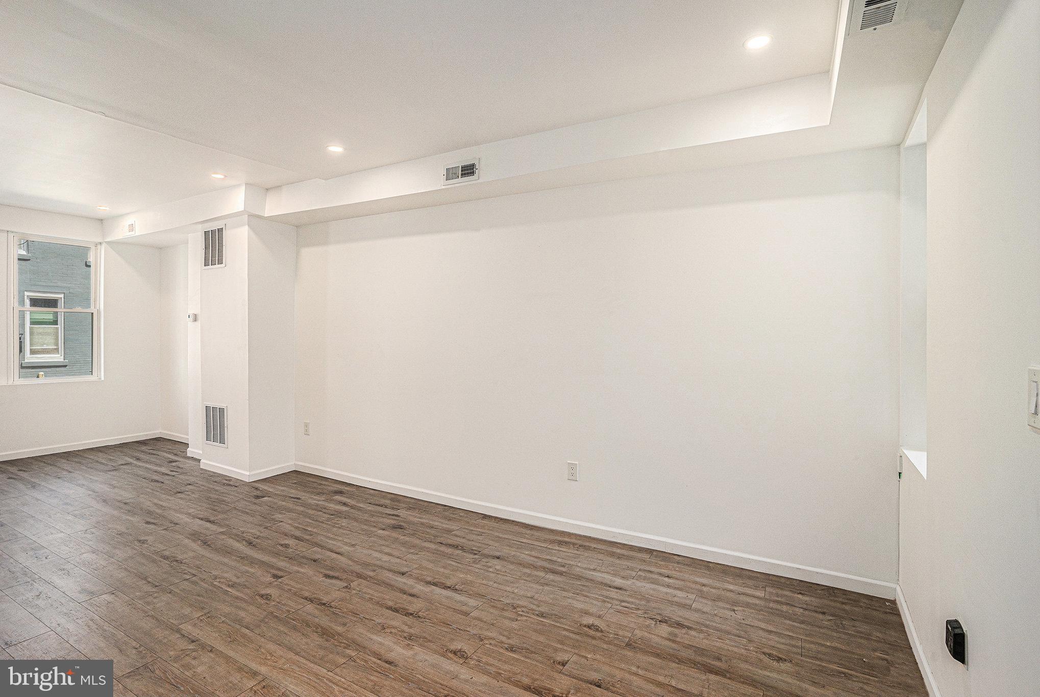 2128 Fernon Street Philadelphia, PA 19145 - Photo 9 of 30 a view of an empty room with wooden floor