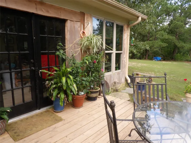 a view of house with yard and entertaining space