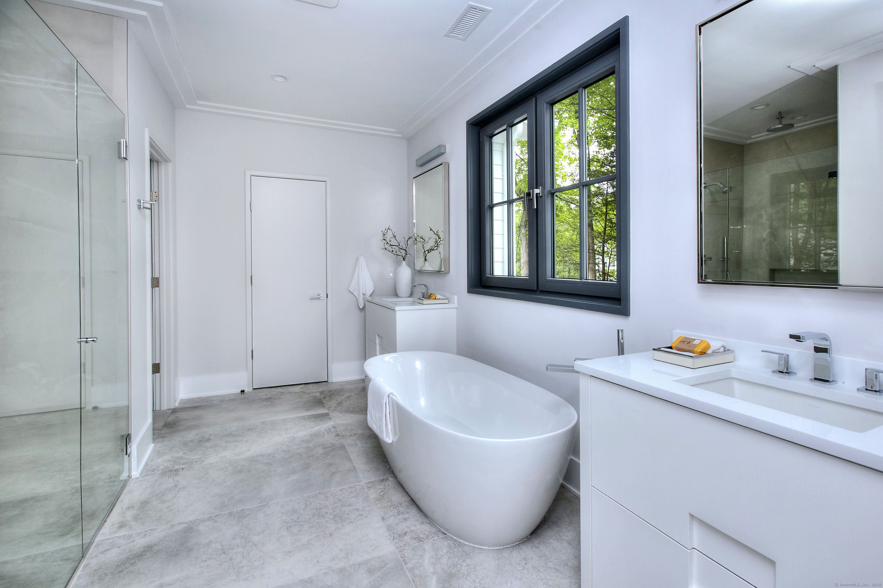 3 Hubbel's Lane Westport, CT 06880 - Photo 17 of 40 The primary bath with a free standing soaking tub, a separate toilet room and linen closet, and a heated floor.