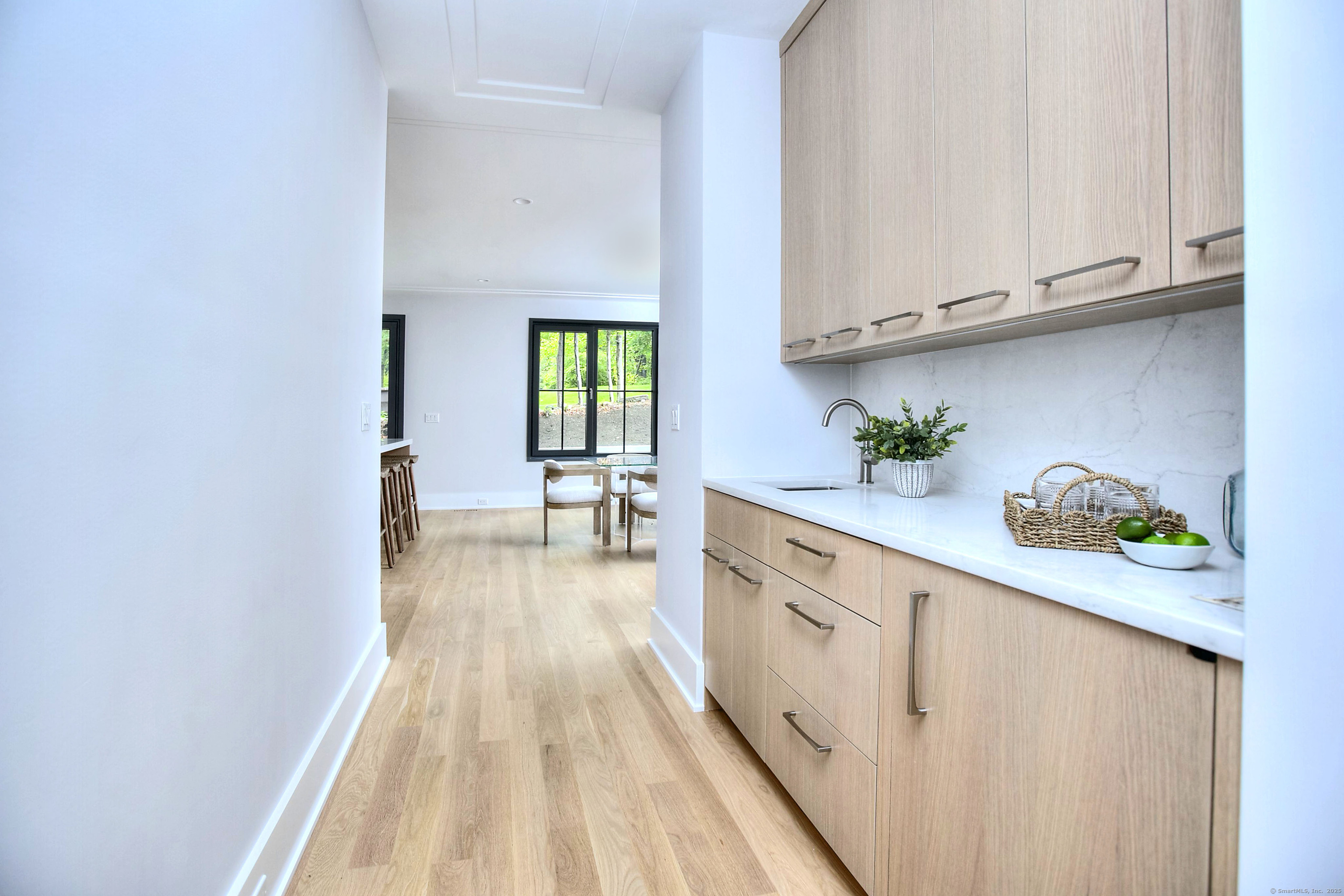 3 Hubbel's Lane Westport, CT 06880 - Photo 5 of 40 And connects to easy kitchen access via the wet bar in the butler's pantry.