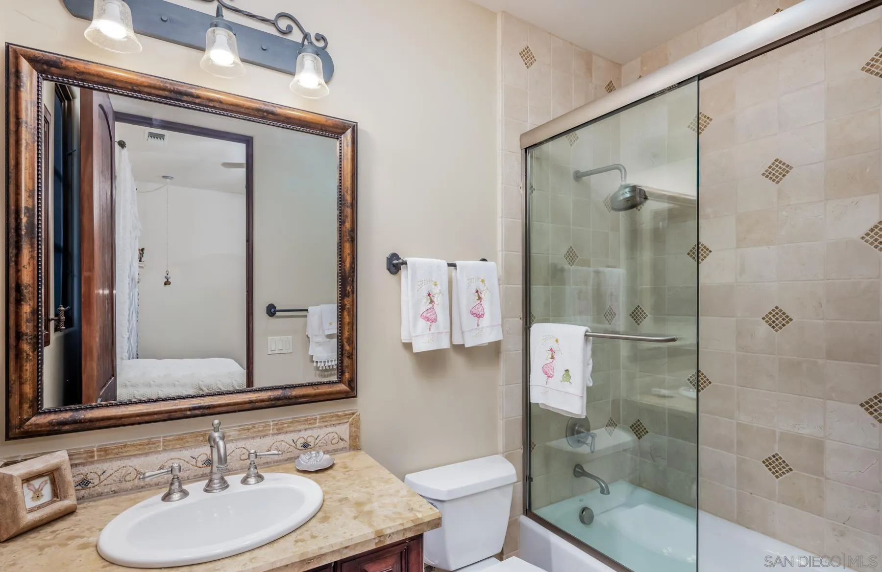 18669 Via Catania Rancho Santa Fe, CA 92091 - Photo 25 of 39 a bathroom with a granite countertop shower sink mirror and toilet