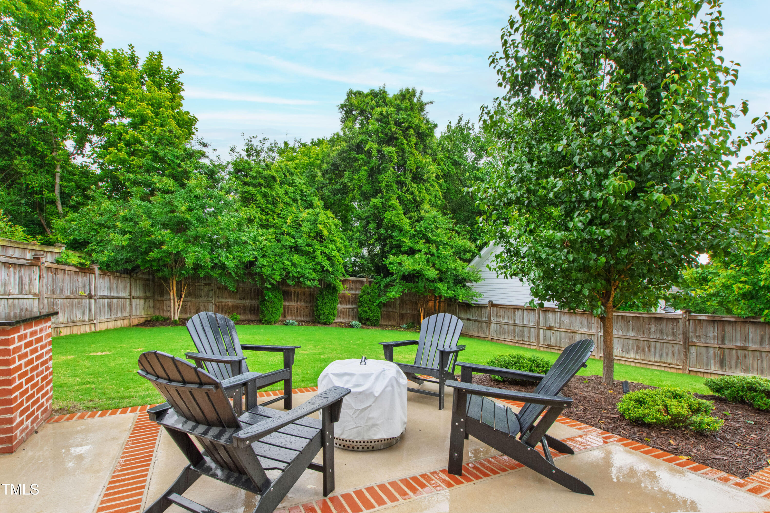 729 Mills Street Raleigh, NC 27608 - Photo 53 of 61 a view of chair and table in the back yard