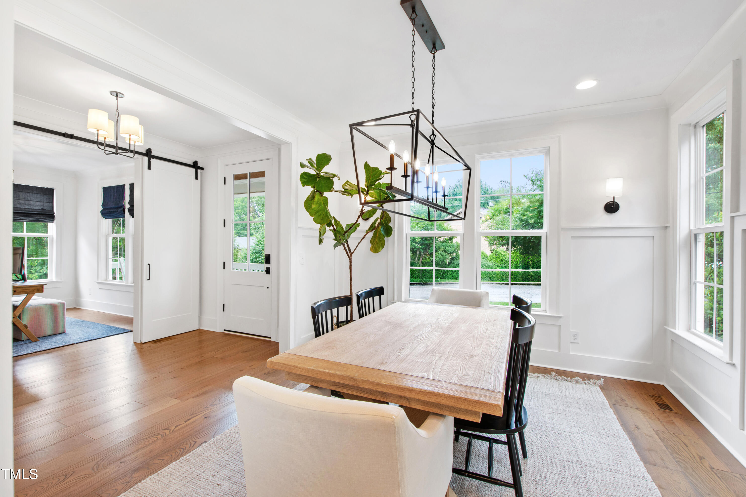 729 Mills Street Raleigh, NC 27608 - Photo 5 of 61 a view of a dining room with furniture window and wooden floor