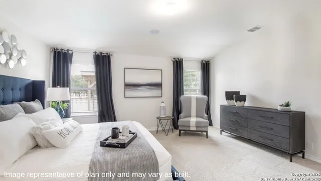 a bedroom with furniture and a wooden floor