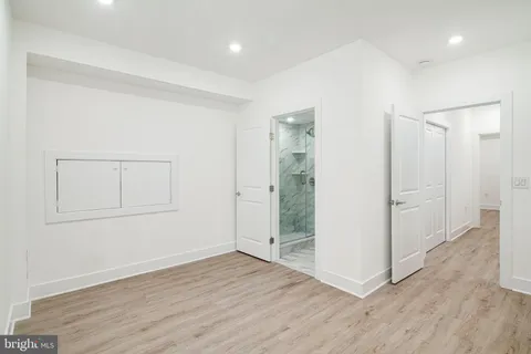 an empty room with wooden floor