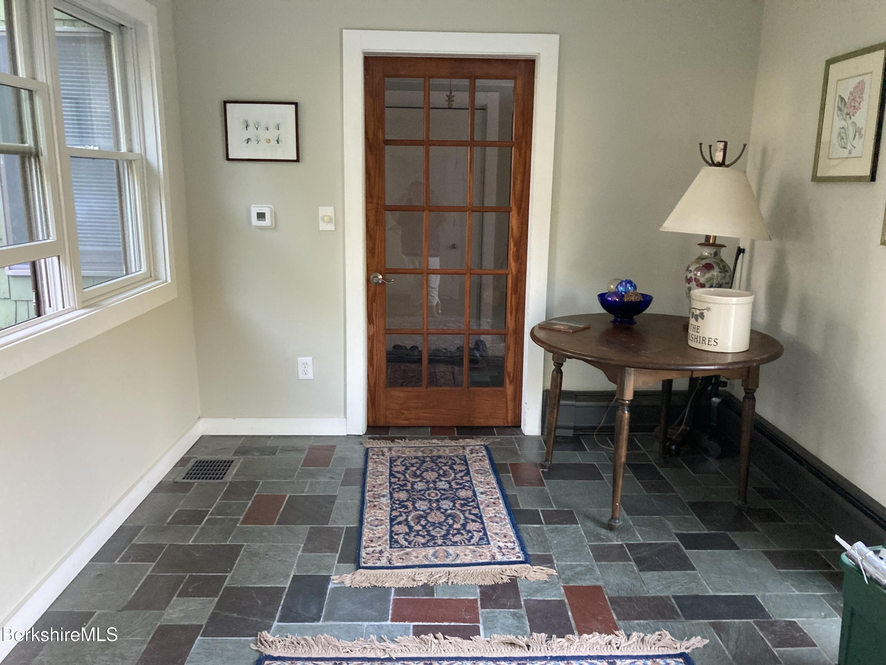 14 Blotz Road Washington, MA 01223 - Photo 3 of 28 a view of a hallway to a livingroom with furniture and wooden floor