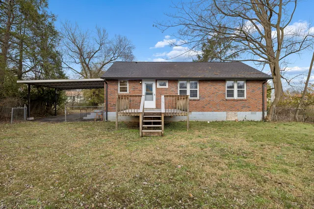 a backyard of a house with yard and garage