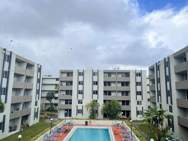 a workspace with a book shelf