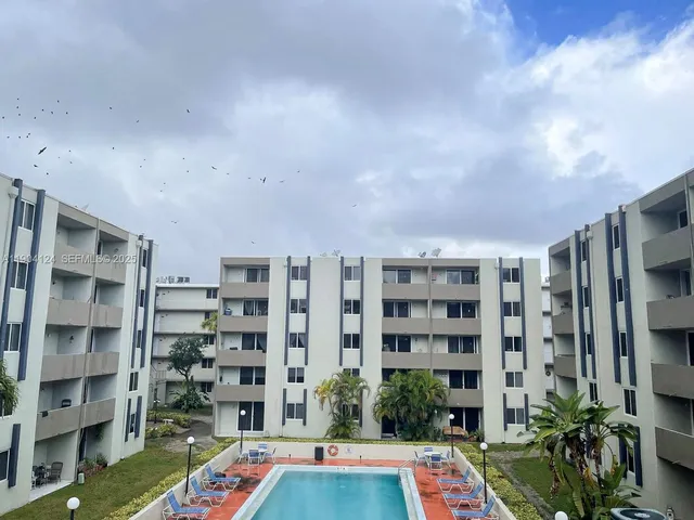 a workspace with a book shelf
