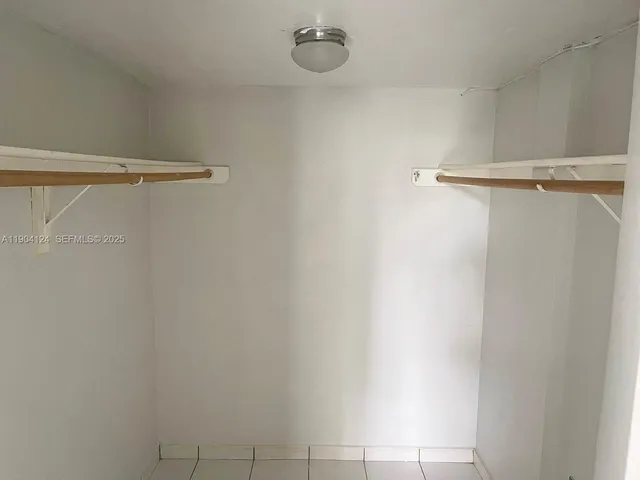 a bathroom with a shower and a toilet