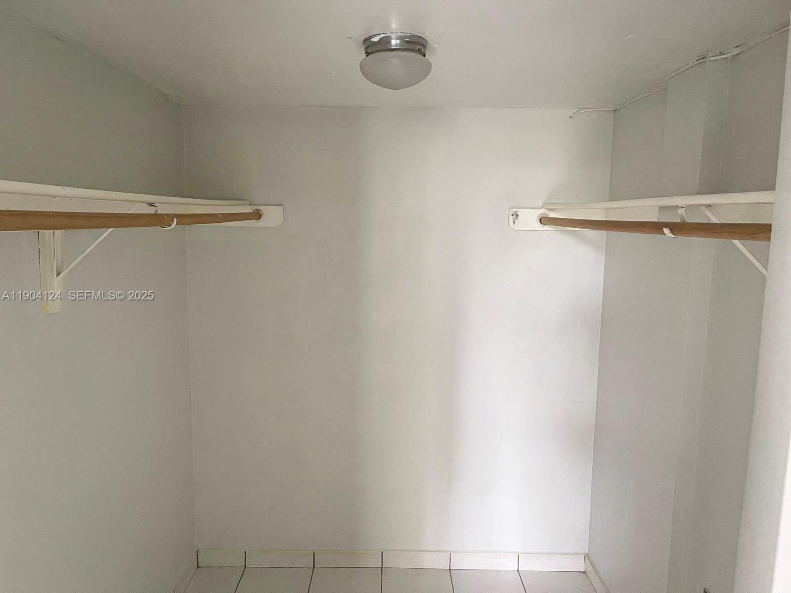 10090 Northwest 80th Court, Unit 1340 Hialeah Gardens, FL 33016 - Photo 13 of 17 a bathroom with a shower